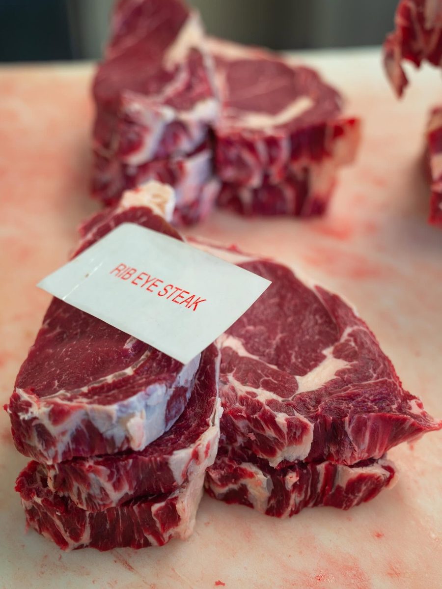 Fresh ribeye steaks labeled and ready